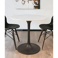 Table à manger ronde plateau marbre blanc piétement fer noir style moderne