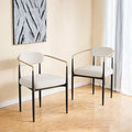 Chaise de salle à manger en velours Teddy crème avec accoudoirs dorés et pieds en métal noir
