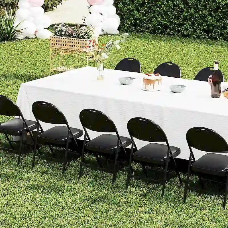 Chaise pliante rembourrée en similicuir PVC noir avec cadre métallique robuste