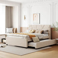 Lit plateforme rembourré beige avec tête de lit géométrique et tiroirs de rangement