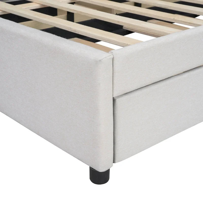 Lit plateforme rembourré beige avec tête de lit géométrique et tiroirs de rangement